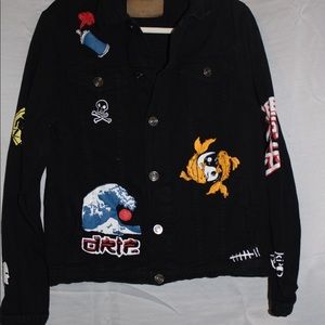 Black denim jacket with colorful vinyl designs